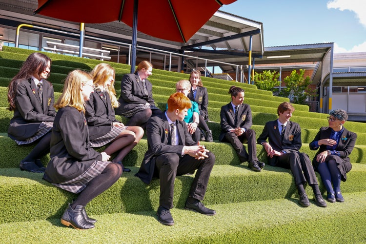 A group of people sitting on steps