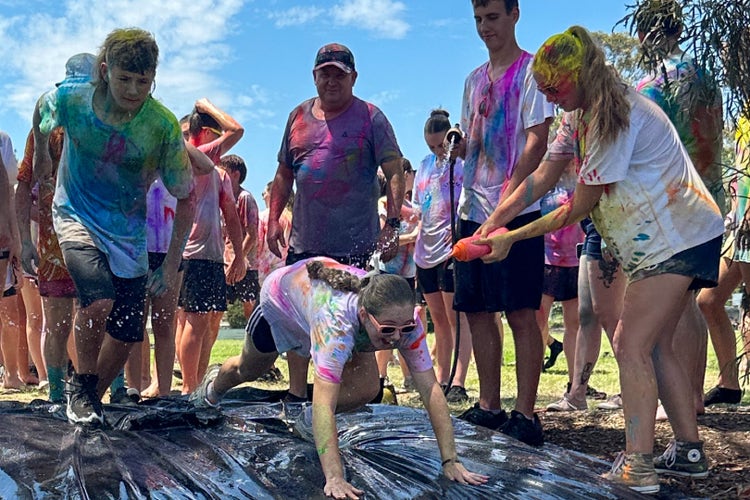 A group of people covered in paint