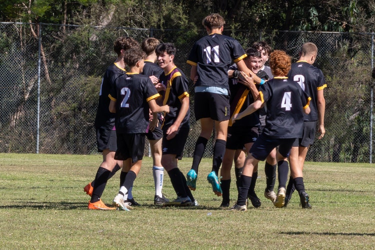 Team of male soccer players on the field