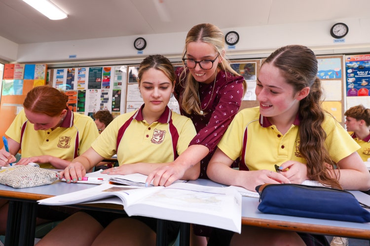 A group of female students in a classroom with female teacher