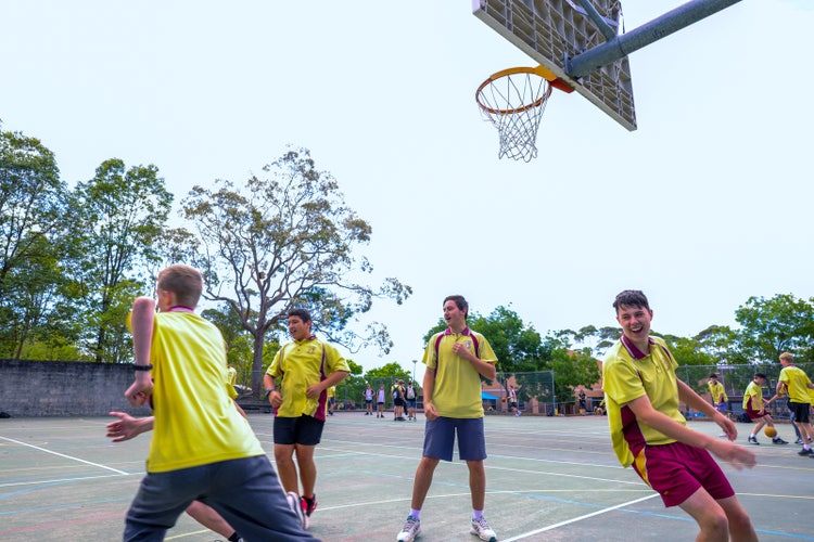 A group of boys playing basketball