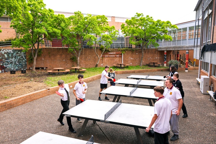 A group of people playing ping pong